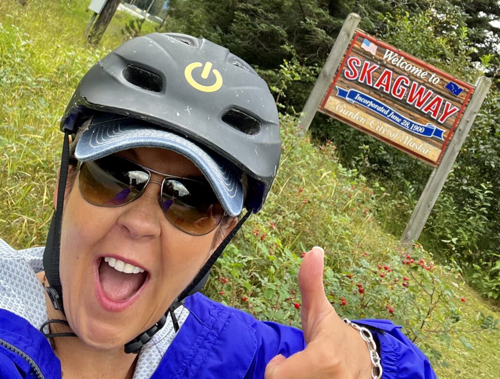 Traveler on a bicycle tour, one of the best things to do in Skagway, Alaska.
