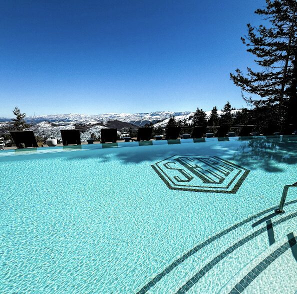 Stein Eriksen Lodge pool and snow covered mountains of Utah